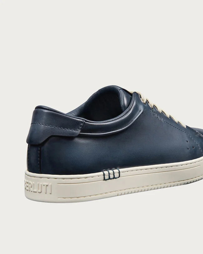 Berluti Playtime sneakers feature navy blue Venezia leather and signature hand