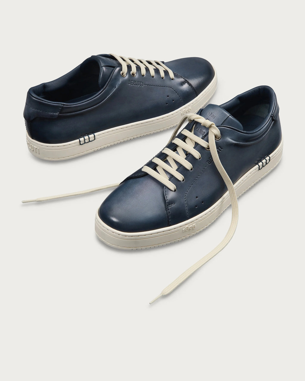 Berluti Playtime sneakers feature navy blue Venezia leather and signature hand