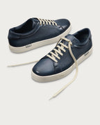 Berluti Playtime sneakers feature navy blue Venezia leather and signature hand